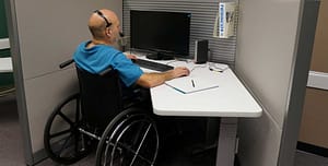 person in wheelchair at work