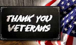 thank you veterans sign with flag in background